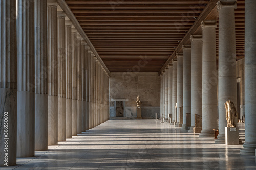 Passage with marble Ionic columns inside stoa of Attalos, ancient agora of Athens before sunset