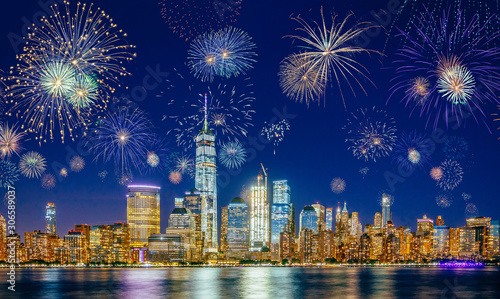 New York City Skyline with Flashing Fireworks - A night long exposure of New Years Eve Celebration