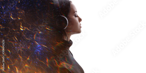 Portrait of woman in headphones listening music with closed eyes. Double exposure of female face, flashes of fire isolated on white background. Digital art. Free space for text.