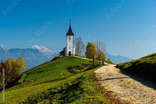 Closeup of Jamnik Church in autumn sunlight, Slovenian Alps