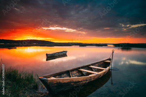 Braslaw Or Braslau, Vitebsk Voblast, Belarus. Wooden Rowing Fishing Boats In Beautiful Summer Sunset On The Dryvyaty Lake. This Is The Largest Lake Of Braslav Lakes. Typical Nature Of Belarus