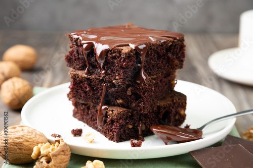 Delicious brownies with melted chocolate on a stack