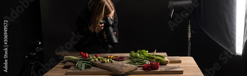 professional photographer making food composition for commercial photography and taking photo on digital camera , panoramic shot