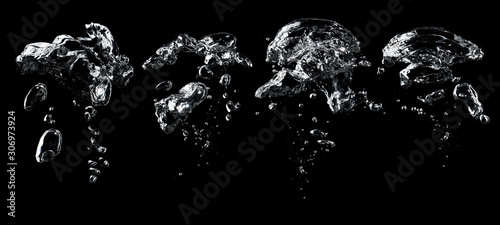Air bubbles in the water on black background.