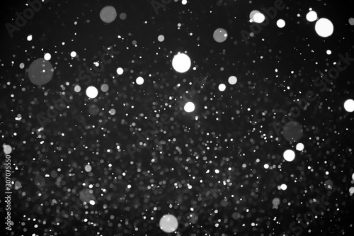 White snow isolated on black background