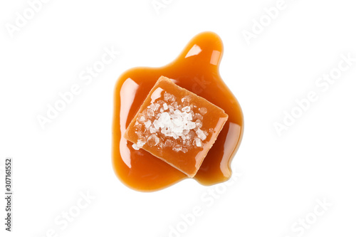 Salted caramel candy with sauce isolated on white background