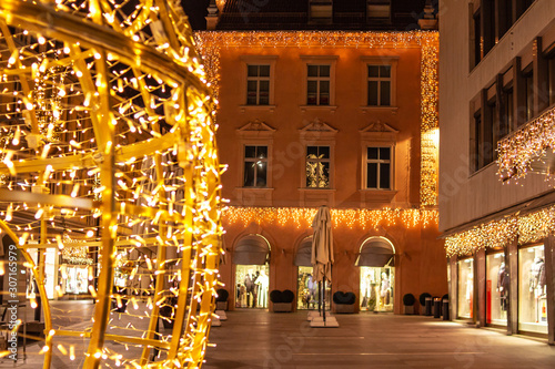 piazza decorated with christmas lights near traditional famous christmas market (christkindlmarkt) at Merano, South Tyrol/Italy