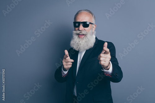 Close-up portrait of his he nice attractive trendy content cheerful cheery cool gray-haired man macho pointing two forefingers take pick you isolated over dark grey pastel color background