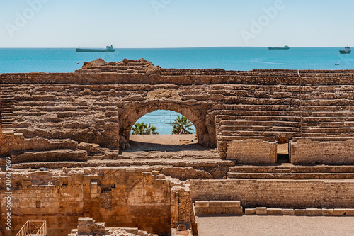 Cambrils Spain August 8, 2013 . Roman amphitheatre of Tarragona, Spain. Tourists take pictures of the sundial. An ancient historical tourist attraction of Catalonia