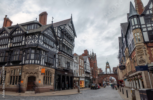 9 August 2019: Chester, Cheshire, England, UK - Half timbered houses in Bridge Street in cloudy day