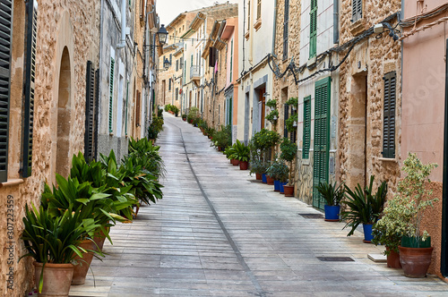 Typical Mallorcan village street with pots and plants on the sides