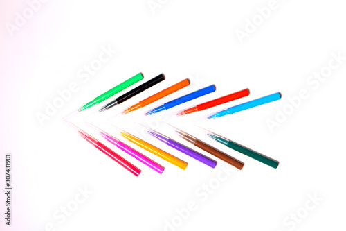 Colorful felt-tip pens on the white background. Markers and pencils pattern. Background or texture.