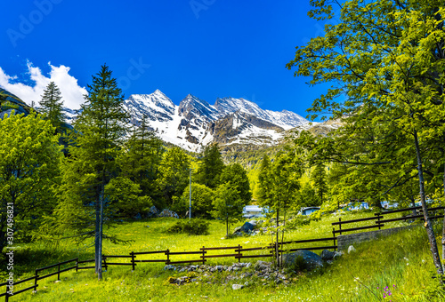 Gran Paradiso Italian alps mountains in Graian Alps in Piedmont, Italy with snow capped peaks.