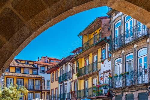 Facades of houses at Largo da Oliveria in the old town of Guimaraes, Portugal