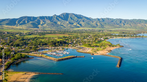Stunning aerial shot of Hawaiian town and mountain behind