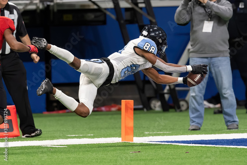 Great action photos of high school football players making amazing plays during a football game