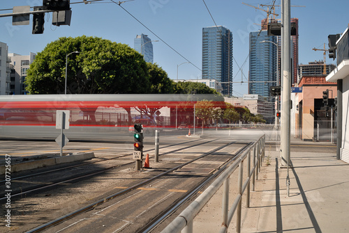 The metro train in Los Angeles crosses perpendicular to Flower St.