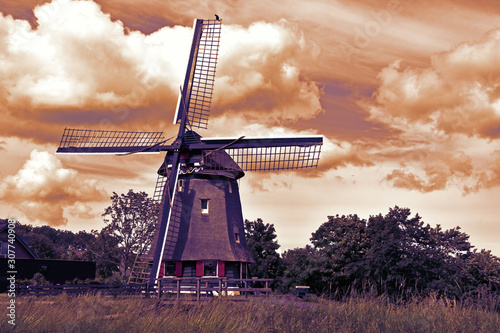 Abstract sepia tone image of traditional old windmill in Edam Holland