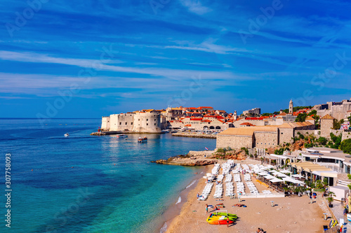 Old Harbour with Fort St Ivana and public Banje Beach in sunny day in Dubrovnik, Croatia