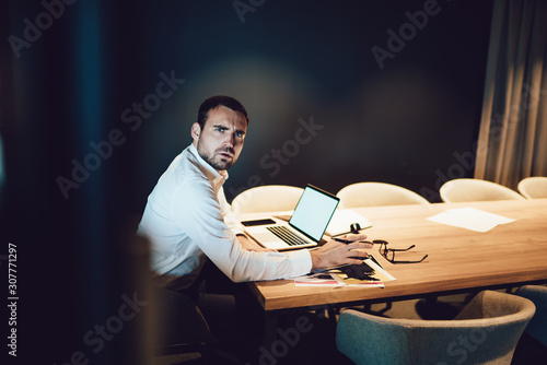 Indignant businessman distracting from work