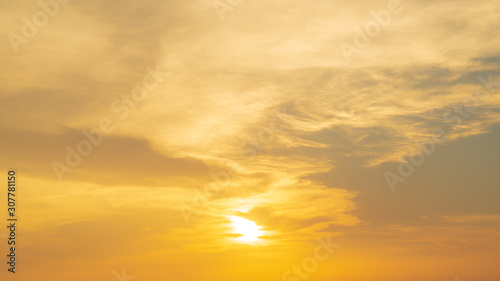 Golden yellow or orange gold sky tone and clouds at sunset or evening time.