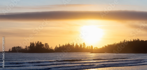 Long Beach, Near Tofino and Ucluelet in Vancouver Island, BC, Canada. Beautiful panoramic view of a sandy beach on the Pacific Ocean Coast during a vibrant sunset.