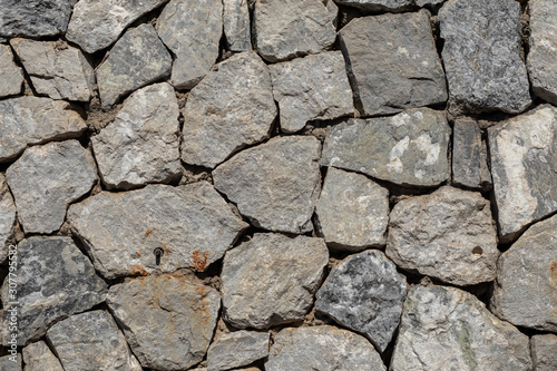 The stones are arranged into layers of stone walls.