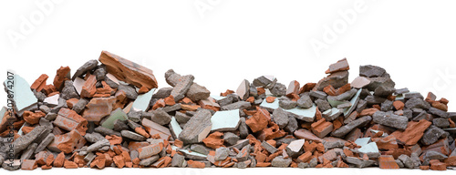 Pieces of concrete and brick rubble debris on building in civil war isolated on white background