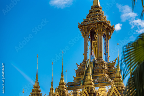 Uthai Thani, Thailand - November, 30, 2019 : Golden pagoda against blue sky at Wat Tha Sung in Uthai Thani, Thailand.
