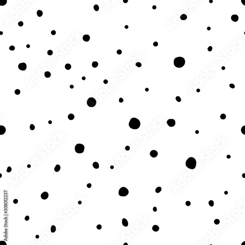 Seamless neutral polka dots pattern. Black hand drawn dots isolated on a white background. Scandinavian cozy ornament. Vector stock illustrations for wallpaper, posters, wrapping paper, textiles