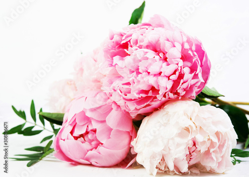 Close up bouquet of fresh beautiful flowers lies on a white background . Horizontal photo.