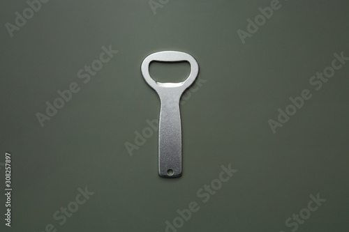 metal bottle opener on dark background