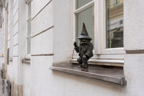 Dwarf on the street windowsill in Wroclaw city, Poland