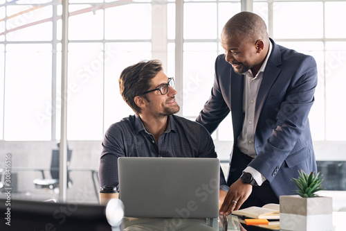 Mature executive helping new employee