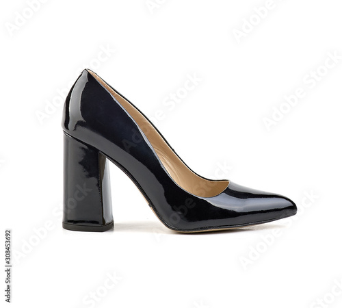 side view of black patent leather women's high-heeled shoes on a white background.