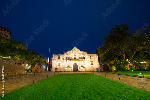 The Alamo Mission at night in downtown San Antonio, Texas, USA. The Mission is a part of the San Antonio Missions World Heritage Site.