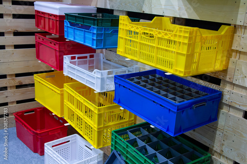 Colored vegetable boxes plastic on stand. Agriculture