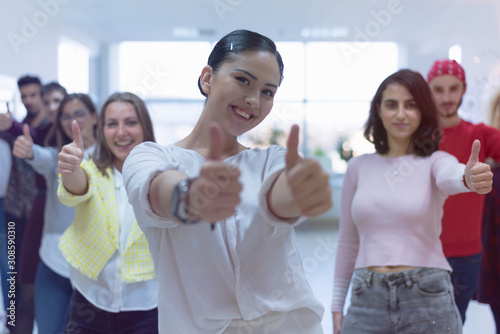 Happy multi ethnic students group showing thumbs up, smiling diverse young people looking at camera with like gesture recommend good quality racial diversity equality, multiracial friendship.