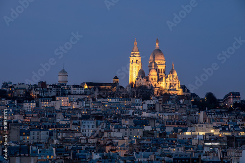Paris, France - December 8, 2019: Sacre Coeur basilica viewed from Galeries Lafayette roof in Paris
