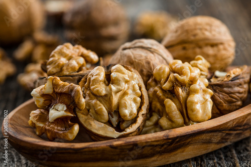 Handful of Walnuts on wooden background