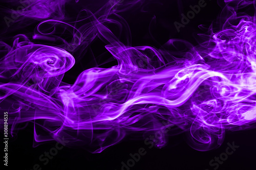 Purple smoke abstract on black background for design. ink water color