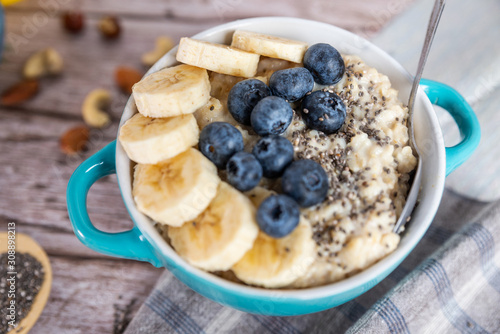 oatmeal with banana and blueberries in a blue bowl
