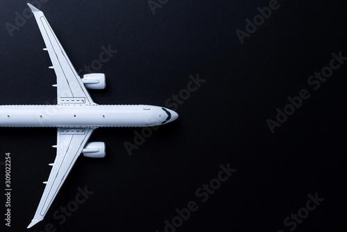 Aircraft model on black background, Top view with empty space. Concept of aircraft industry, airline safety, security and traveling insurance