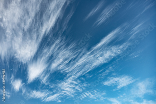 Scenic fluffy cirrus and stratus clouds in the blue sky