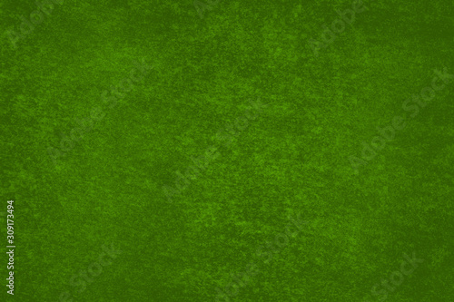 Fondo verde de una pared con manchas.