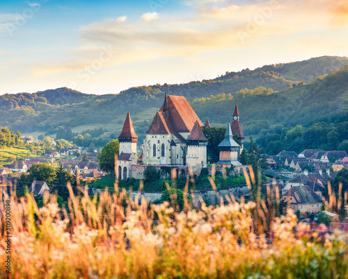 Gorgeous summer view of Fortified Church of Biertan, UNESCO World Heritage Sites since 1993. Captivating morning cityscape of Biertan town, Transylvania, Romania, Europe.