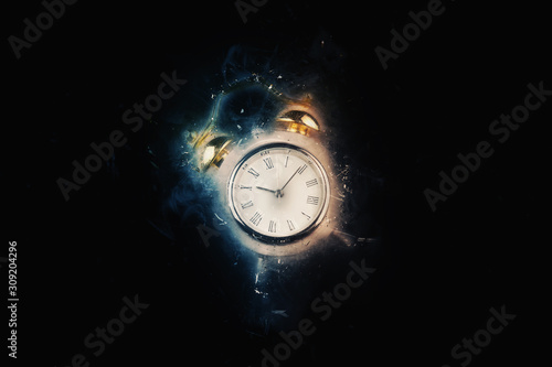 old clock on black background at midnight