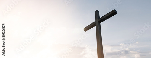 Wooden cross over sunrise background