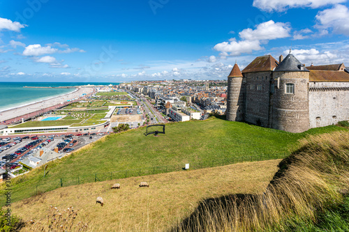 Panoramic view of Dieppe town, fishing port on the English Channel. On a clifftop overlooking pebbly Dieppe Beach is the centuries-old Chateau de Dieppe, now the museum. Sheeps gazing