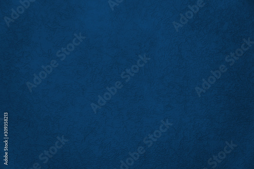 Blue texture painted wall with crack for interior background. Color of the Year 2020 Classic Blue